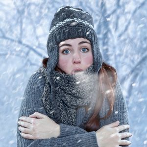 Woman standing outside in cold weather